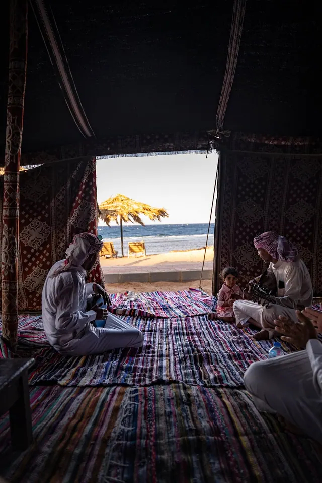 A Bedouin gathering with music beside the sea