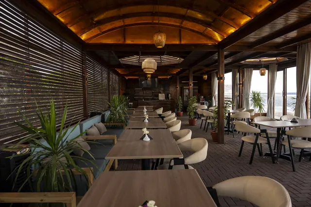 Wooden interiors and dining tables at Zowwada